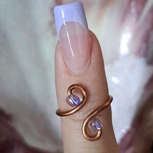 Elegant Copper Swirl Ring with Iridescent Accents